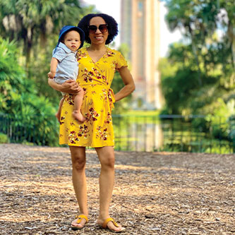 A mother and child standing in front of the Tower. Read about Gifts of Real Estate