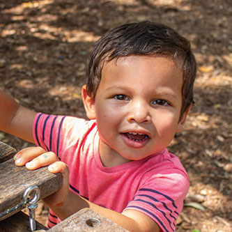 A boy playing. Read about Gifts of Life Insurance